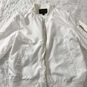 white bomber jacket with gold detailing